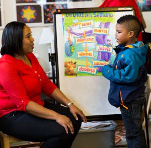 student talking with his teacher